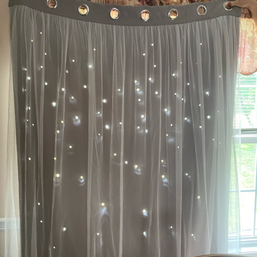 Black out curtains w stars cut out & tulle overlay